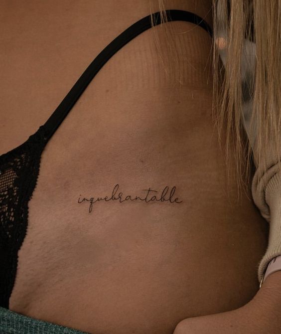 Intimate tattoo with inscription for women