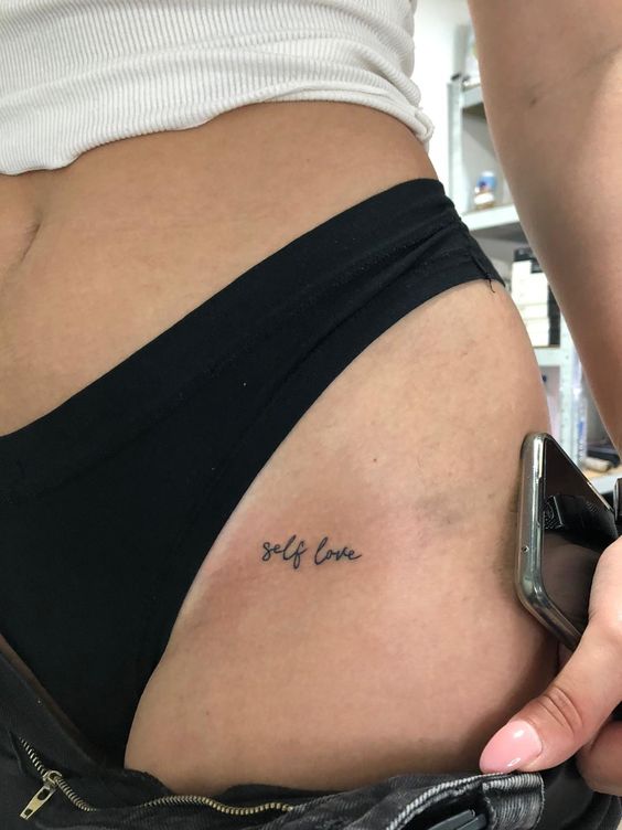 Intimate tattoo with inscription for women