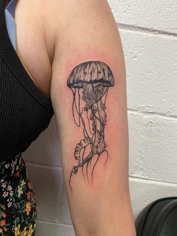 Jellyfish tattoo on the shoulder for women