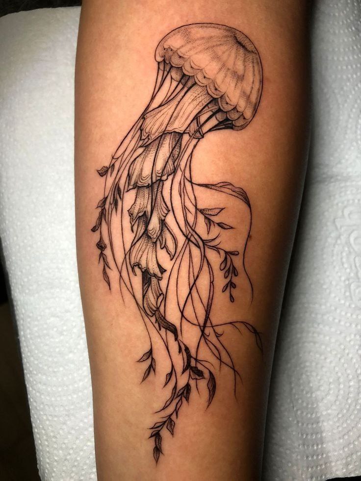 Jellyfish tattoo on the shin for women