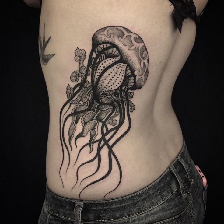 Large jellyfish tattoo on the side for women