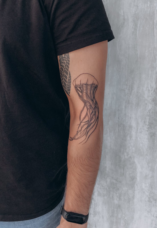 Large jellyfish tattoo on the arm for men