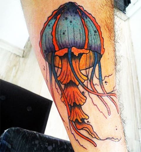 Colored jellyfish tattoo on the arm for men