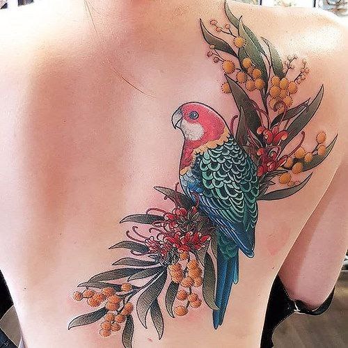 Large parrot and flower tattoo on the back for women