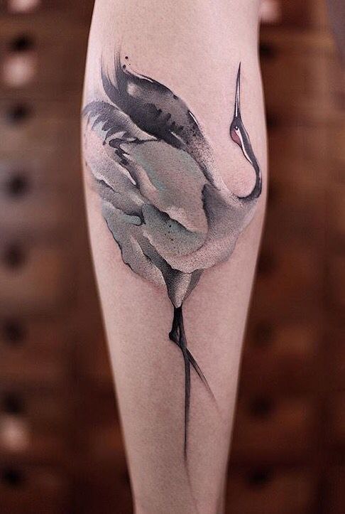 Large stork tattoo on the forearm for women