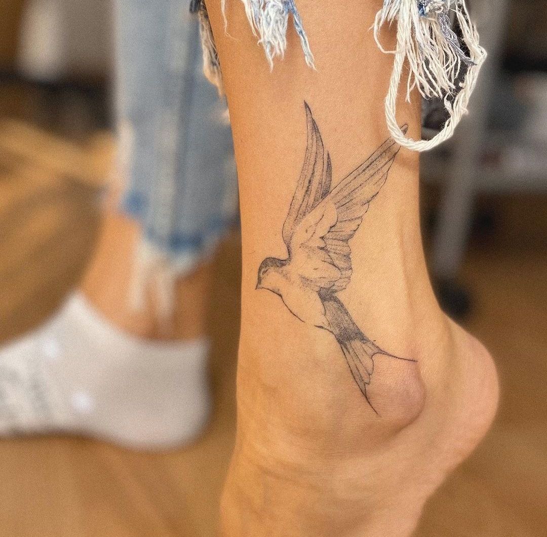 Large ankle swallow tattoo for women