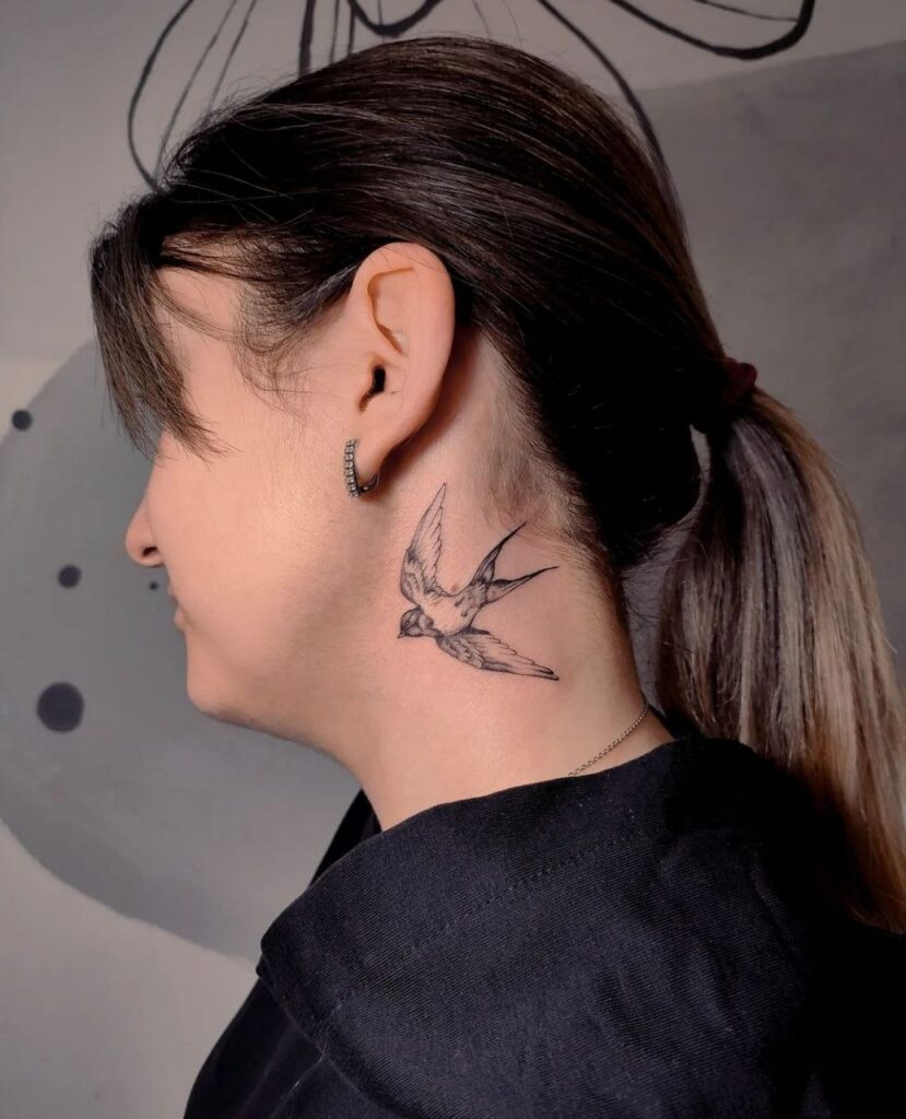 Large swallow neck tattoo for women