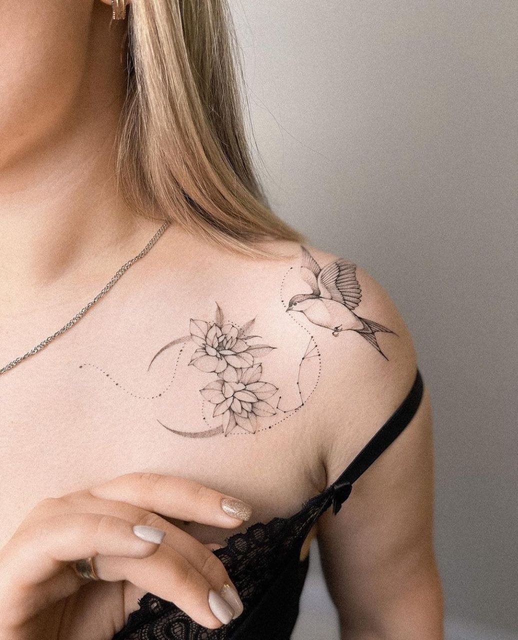 Swallow tattoo on the shoulder for women