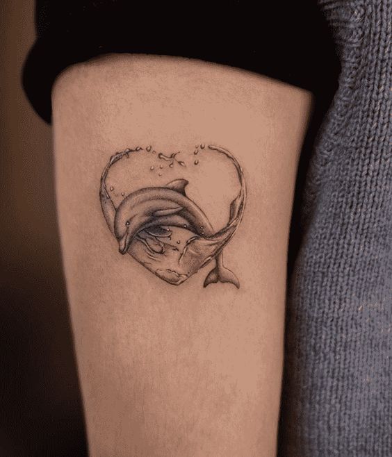 Tattoo of a dolphin on the shoulder for men