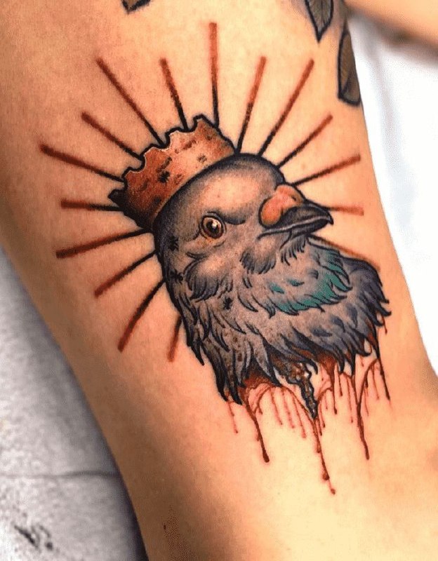 Color tattoo of a dove on the leg for women