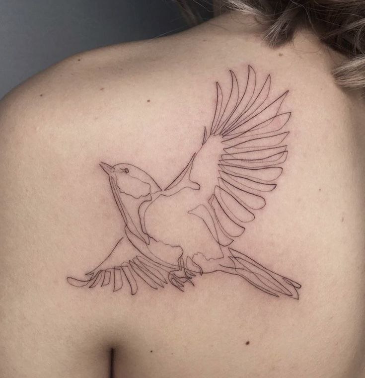 Large pigeon tattoo on the shoulder blade for women