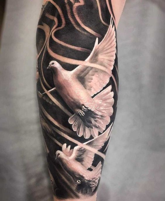 Large tattoo of two pigeons on the leg for men