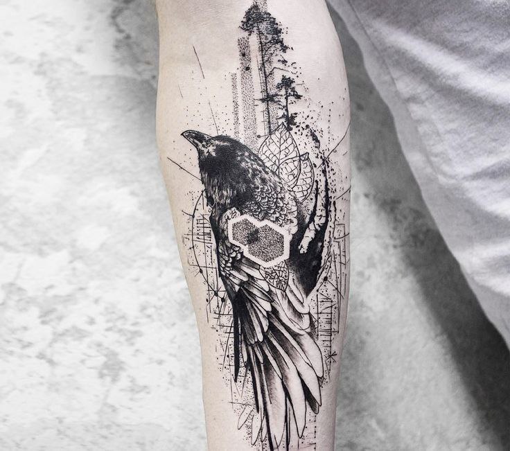 Large tattoo of a raven on the forearm for men