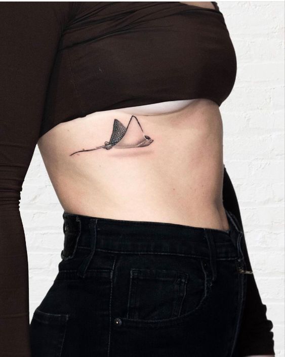 Stingray tattoo on the side for women