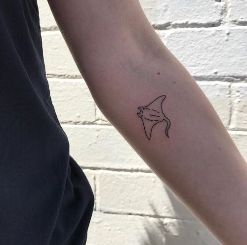 A small stingray tattoo on the forearm for men