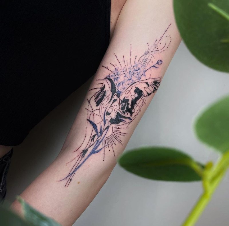 Colorful stork tattoo on the shoulder for women