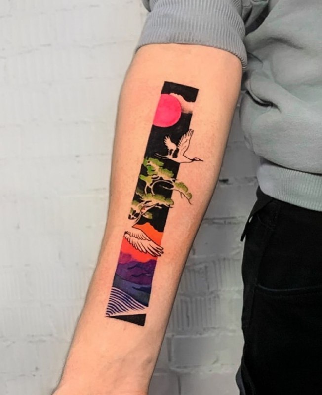 Colorful stork tattoo on the forearm for women