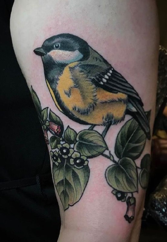 Large tit tattoo on the shoulder for men