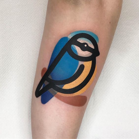 Color tattoo of a tit on the forearm for women