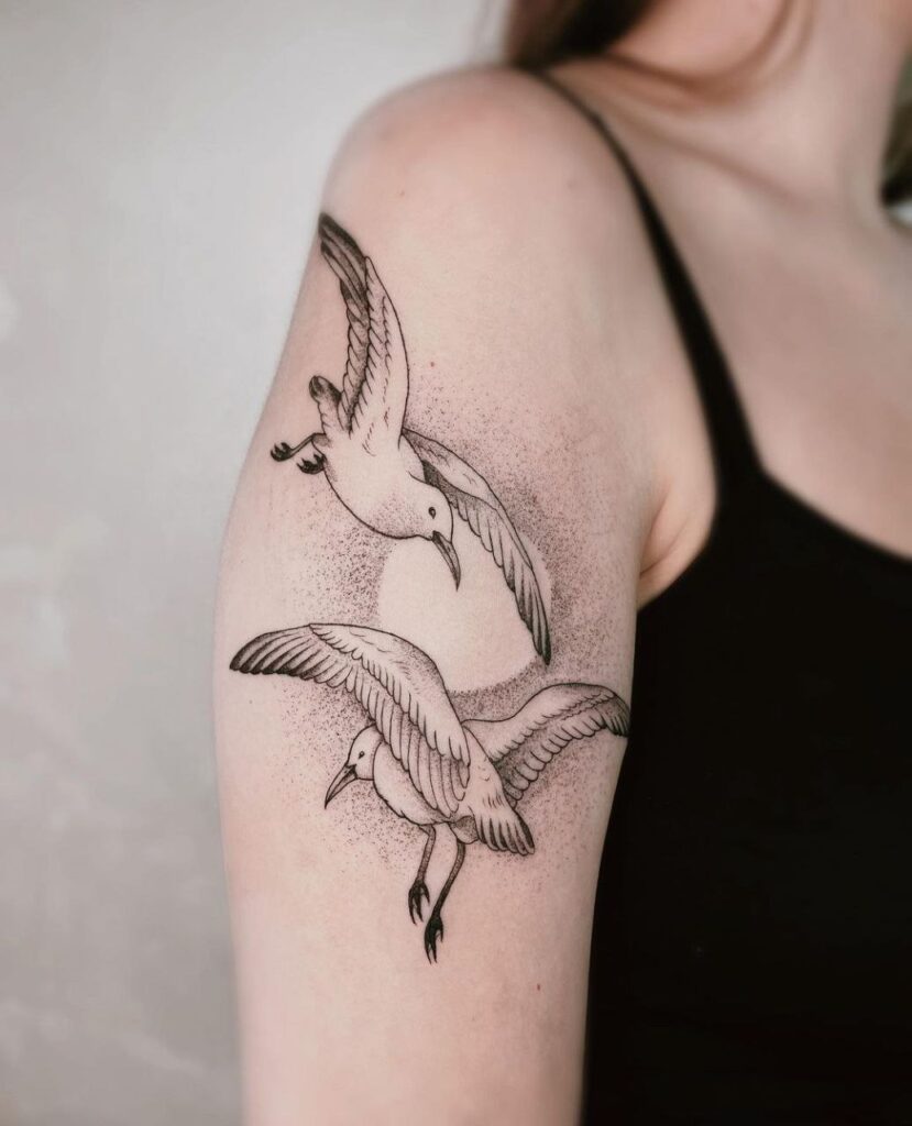 Large tattoo of two seagulls on the shoulder for women Large tattoo of two seagulls on the shoulder for women