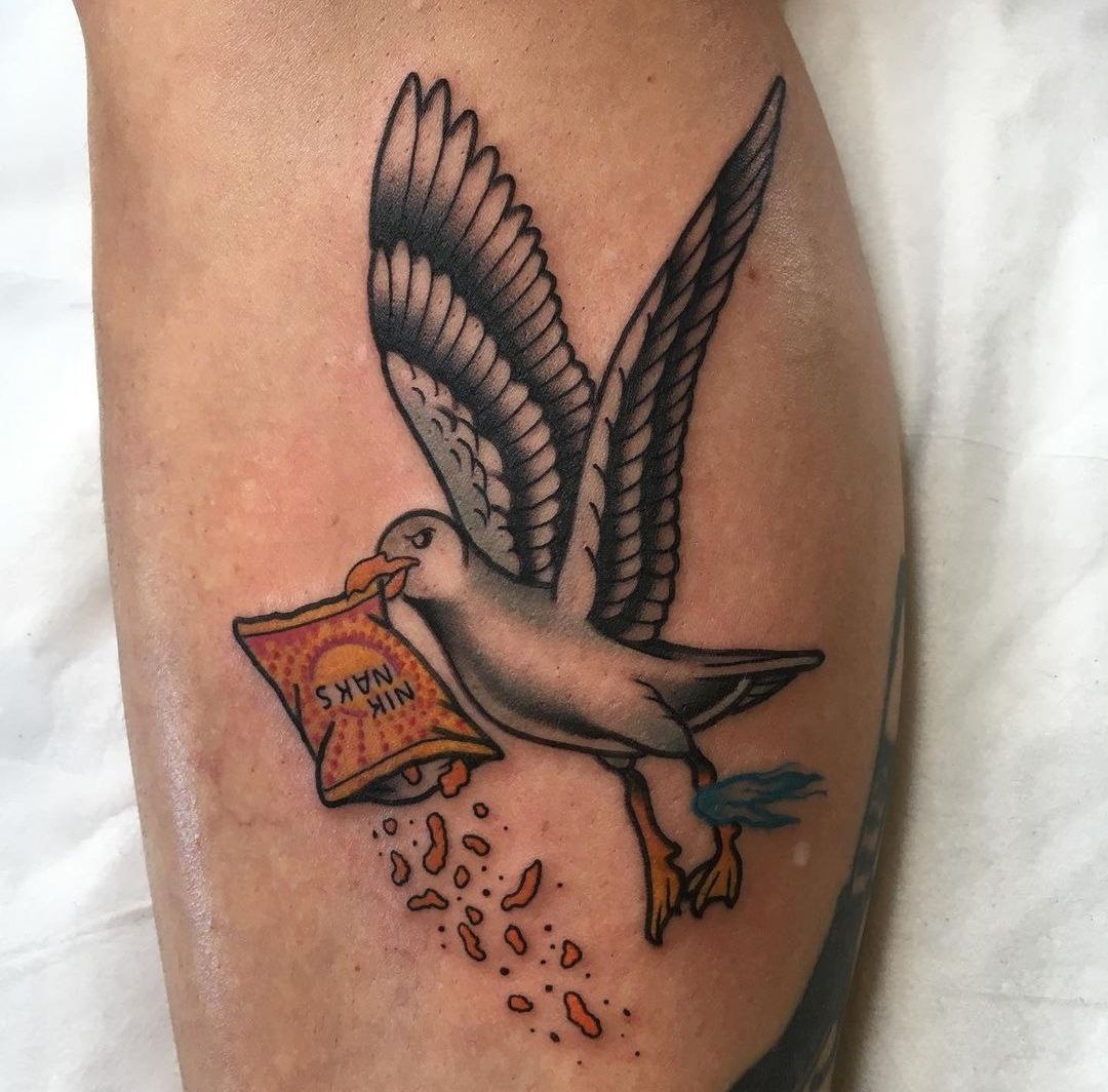 Color tattoo of seagulls on the shin for men