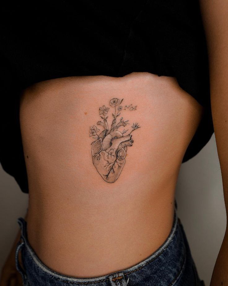 Heart tattoo on the side for women