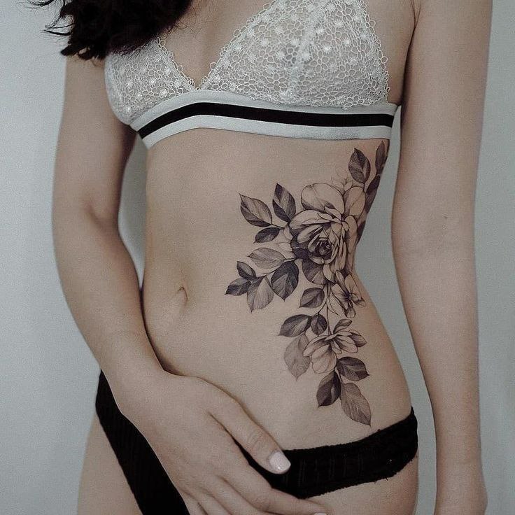 Flower tattoo on the side for women