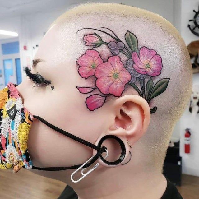 Flower tattoo on the head for women