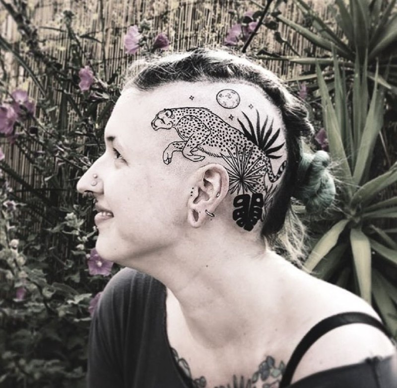 Leopard tattoo on the head for women