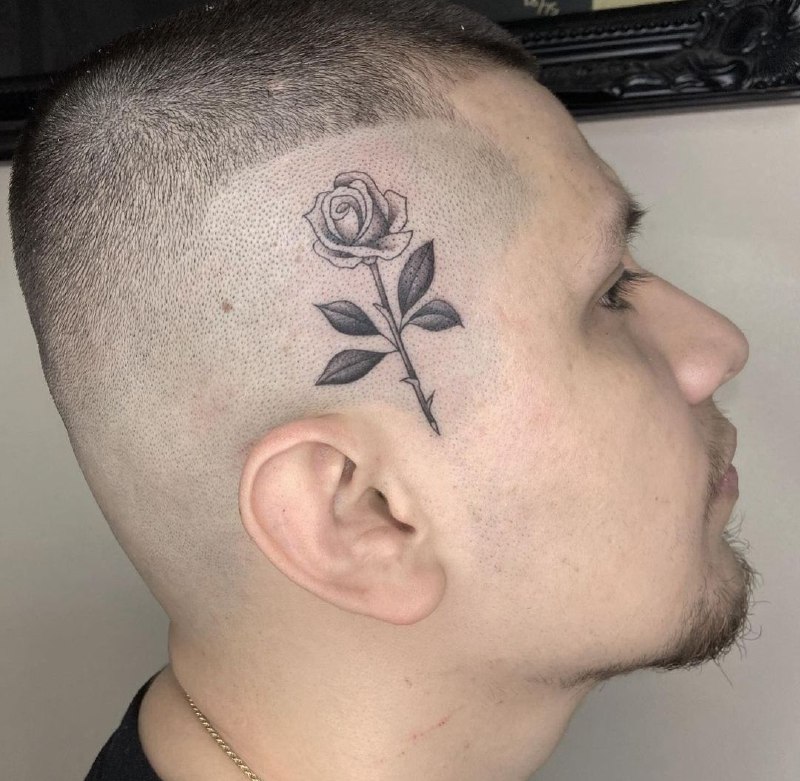 Rose tattoo on the head for men