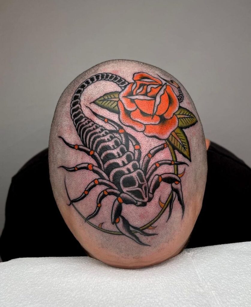 Large cancer and rose tattoo on the head for men