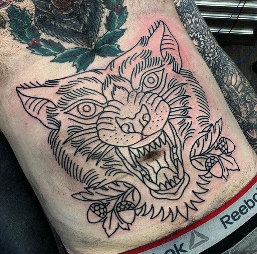 Large tiger tattoo on the abdomen for men