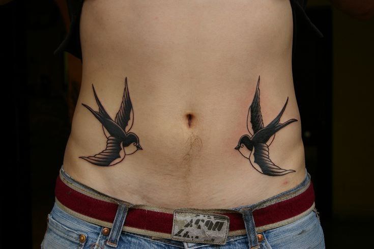 Tattoo of two swallows on the stomach for men