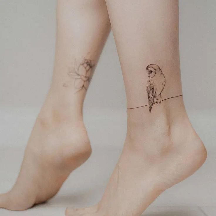 Tattoo of an owl on the shin for women