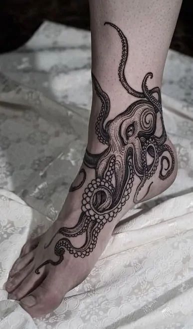 Large jellyfish ankle tattoo for women