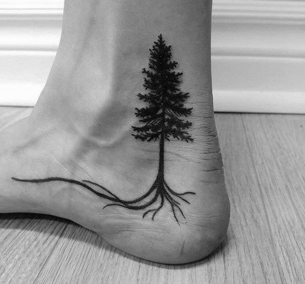 Big christmas tree tattoo on the ankle for men