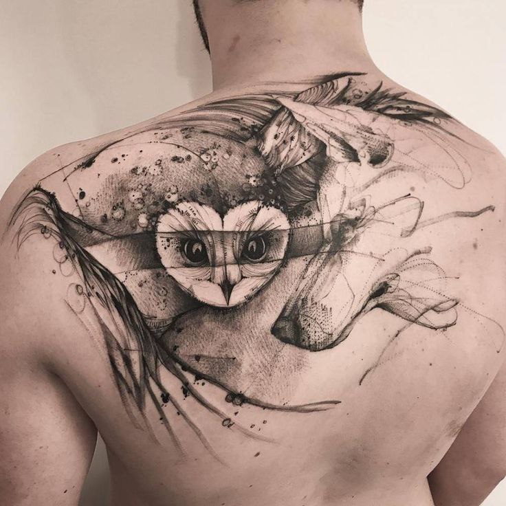 Large owl tattoo on the shoulder blade for men