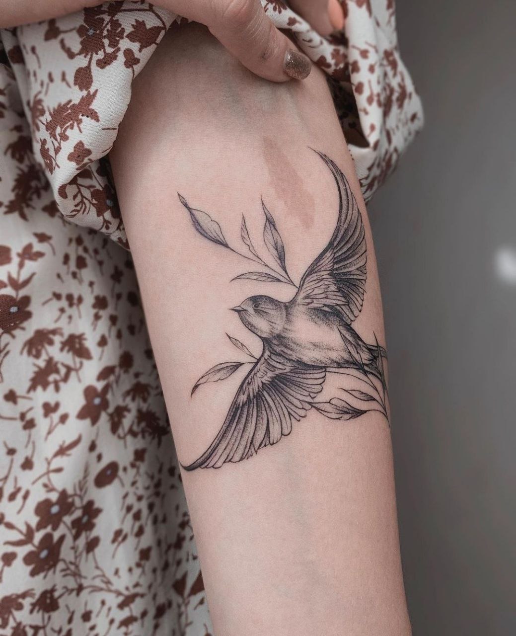 Large swallow tattoo on the shoulder for women