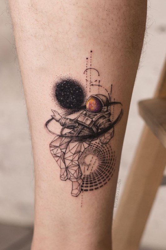 Colored astronaut tattoo on the leg for men