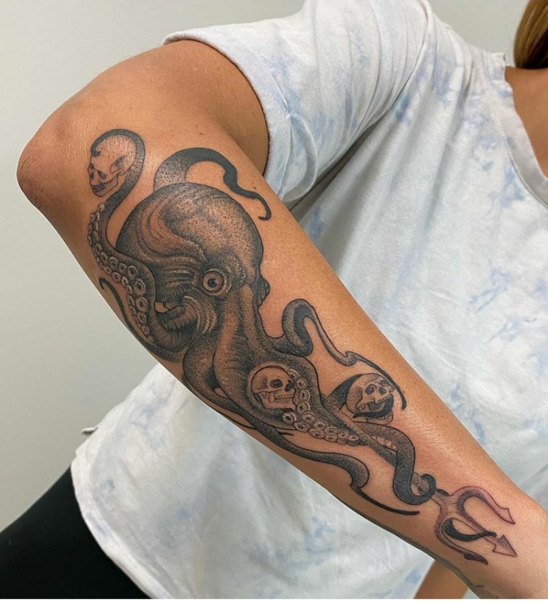 Large octopus tattoo on the forearm for women