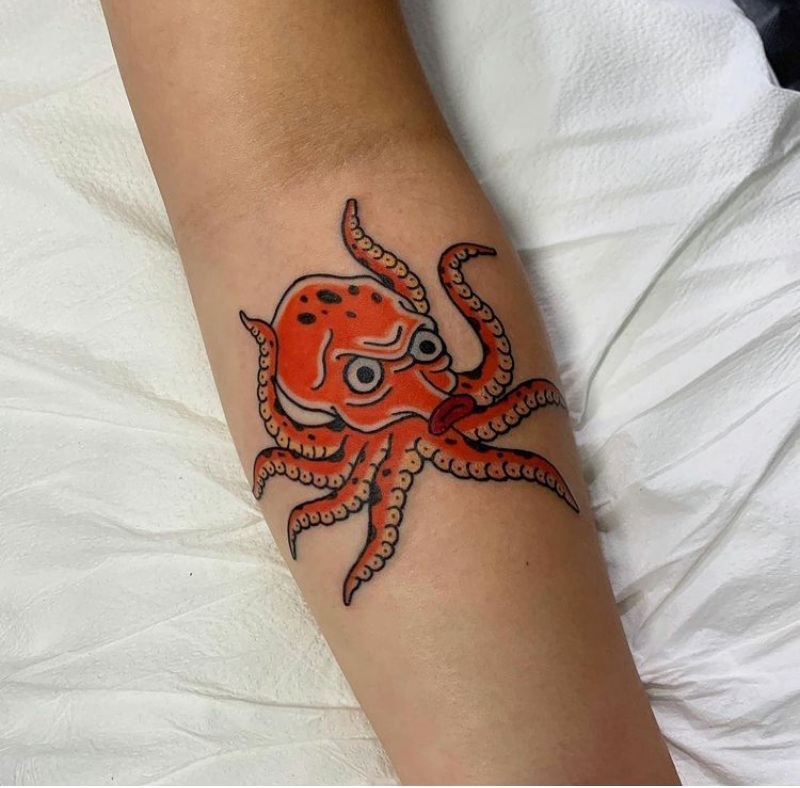 Colorful octopus tattoo on the forearm for women