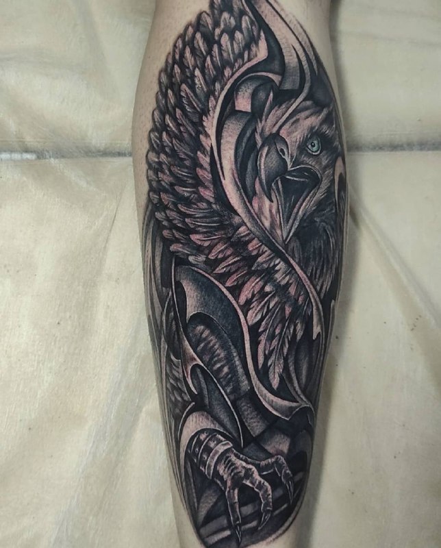 Large griffin tattoo on the leg for men