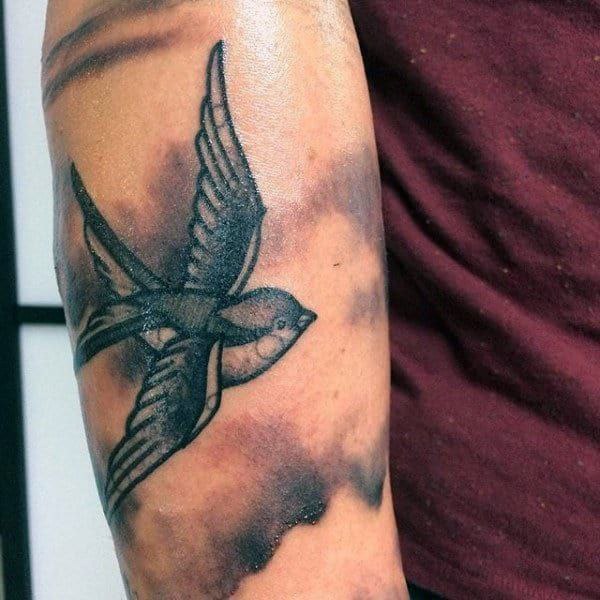 Large sparrow tattoo on the shoulder for men