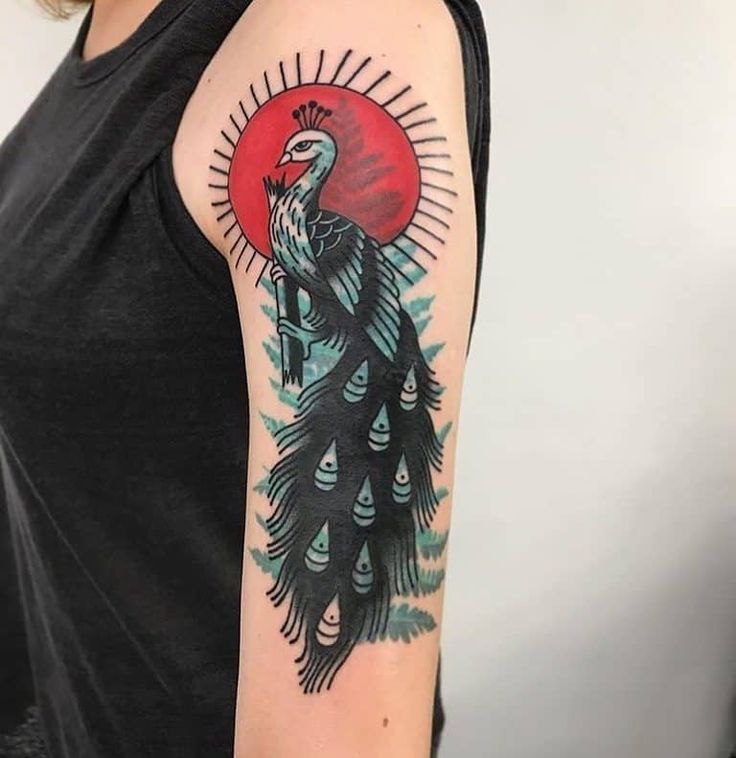 Colorful peacock tattoo on the shoulder for women