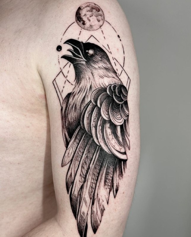 Large tattoo of a raven on the shoulder for men