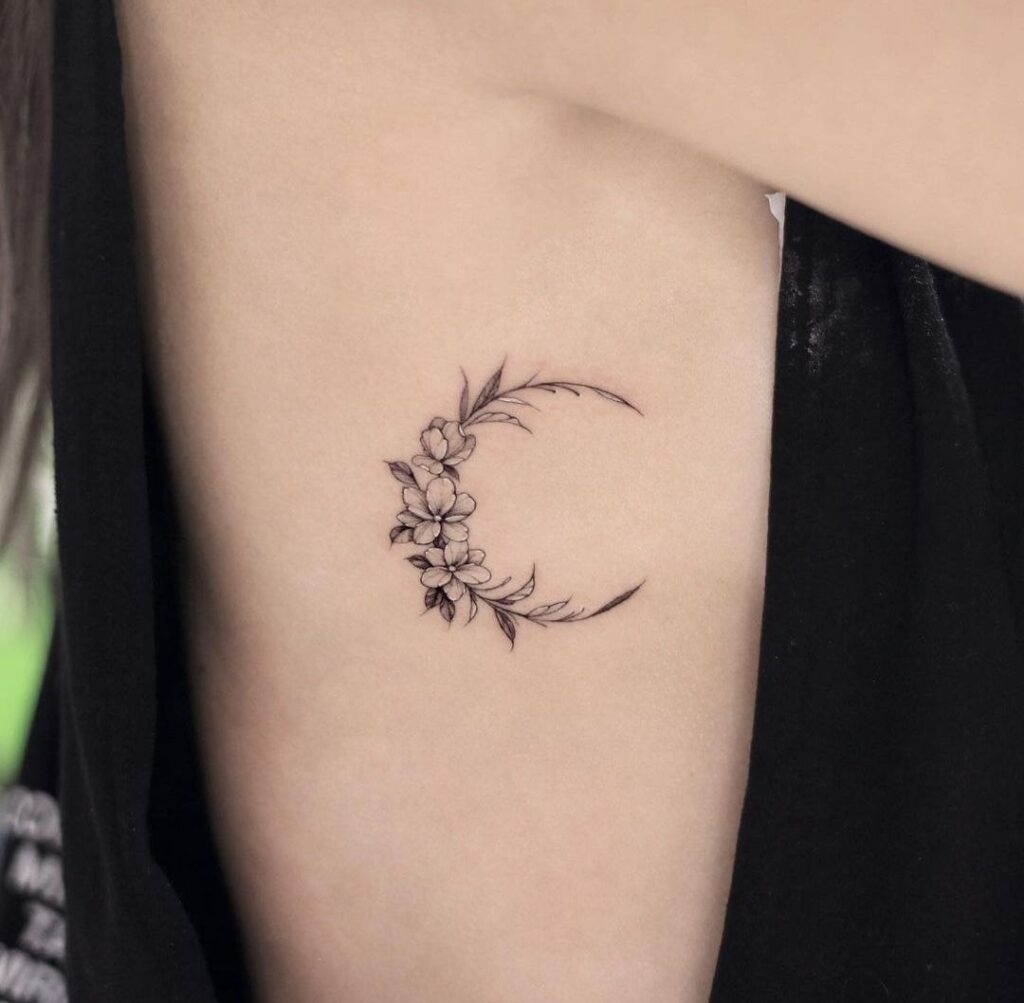 Flower tattoo on the side for women