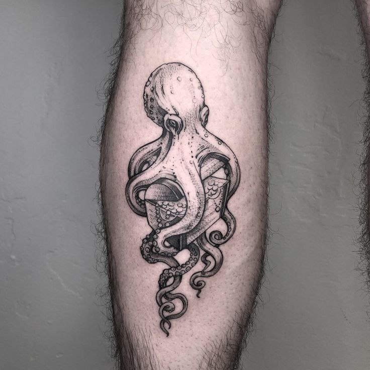 Large octopus tattoo on the calf for men