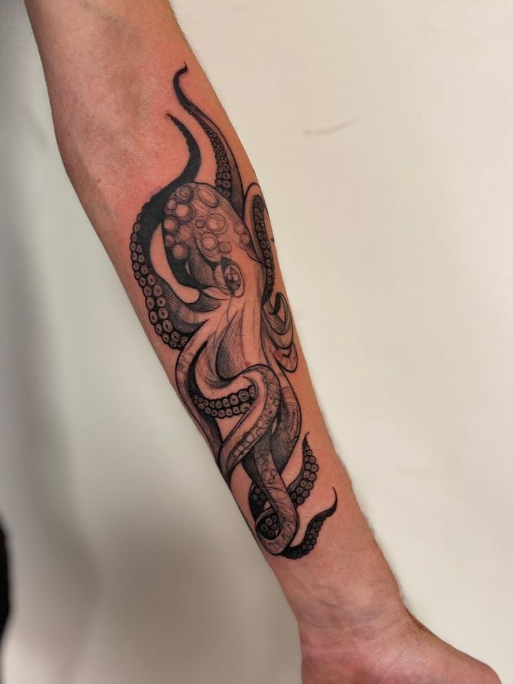 Tattoo of an octopus on the forearm for men