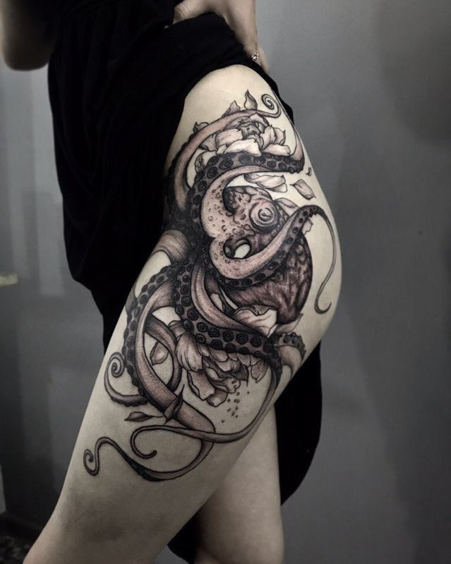 Large octopus tattoo on the thigh for women