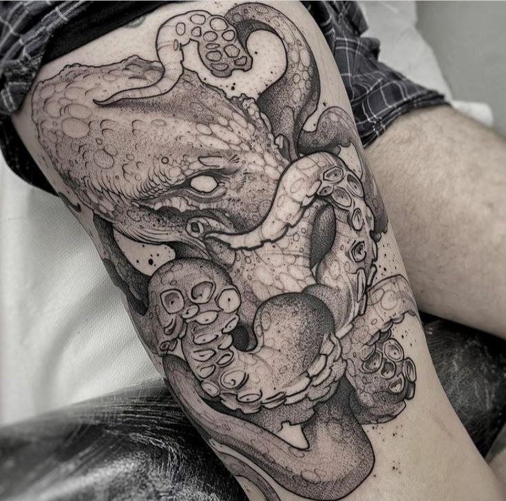 Large octopus tattoo on the thigh for men